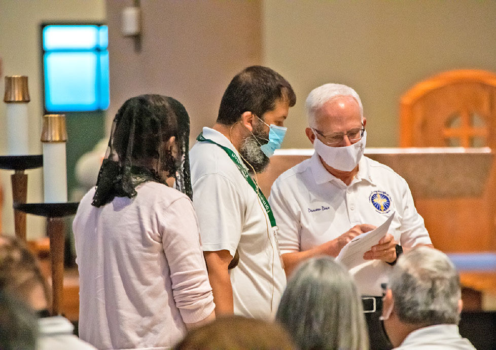 Deacon Dave Camous assists candidates in formation prior to the Diaconate Rite of Candidacy, Aug. 14, 2021, Sts. Peter and Paul Parish, Winter Park.